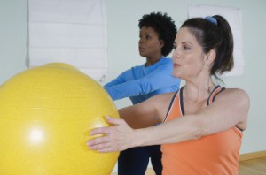 beautiful-women-using-exercise-balls-in-fitness-class