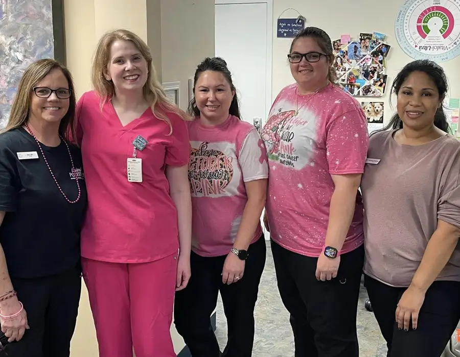 One of our other midwives, Kristen Cook in her all pink scrubs - posing with our nurses!